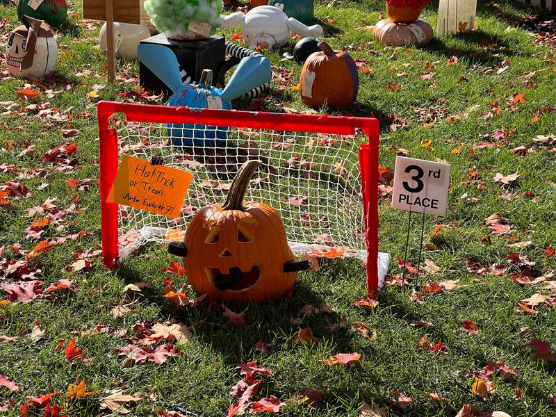 It's "Hat trick or treat," for Artie Eustis, who won third place in the 7 and under carved pumpkin category. On Oct. 25, 2024, his pumpkin was still minding the net on the lawn of the DeKalb County Courthouse.