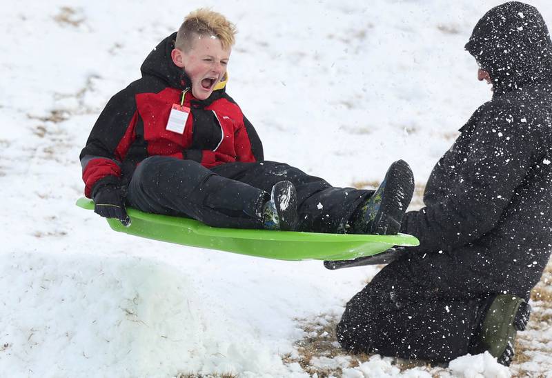 Sawyer Blank, 10, from Hinckley, catches some air on the Sycamore Park District Northwestern Medicine Sled Hill Wednesday, Jan. 25, 2023, in Sycamore.