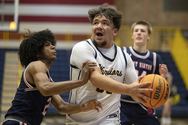 Sterling’s Maddux Osborn goes to the hoop against St. Viator’s Dawson Charles Monday, Jan. 20, 2025, during Sterling’s MLK Classic.