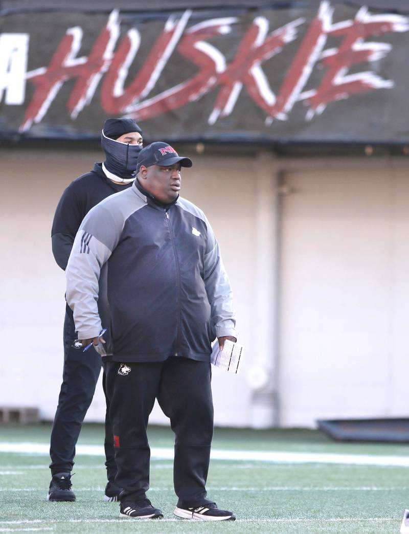 Northern Illinois University football head coach Thomas Hammock watches his team during spring practice Friday, April 7, 2023, in Huskie Stadium at NIU in DeKalb.