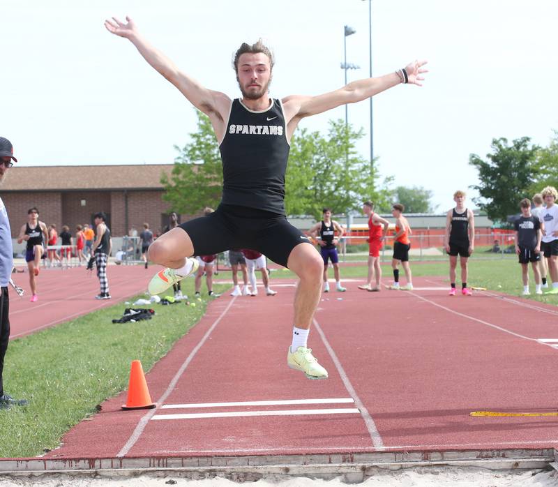 Sycamore's Pierce Rainhard does the long jump during the I-8 Boys Conference Championship track meet on Thursday, May 11, 2023 at the L-P Athletic Complex in La Salle.