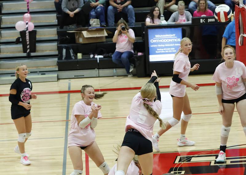 EP’s Aubrey Misfeldt sends a last second free ball over the net much to her teammate's delight on Tuesday, Oct. 7, 2025, as the Panthers hosted the Red Devils in Prophetstown. The Panthers won the match in two sets.