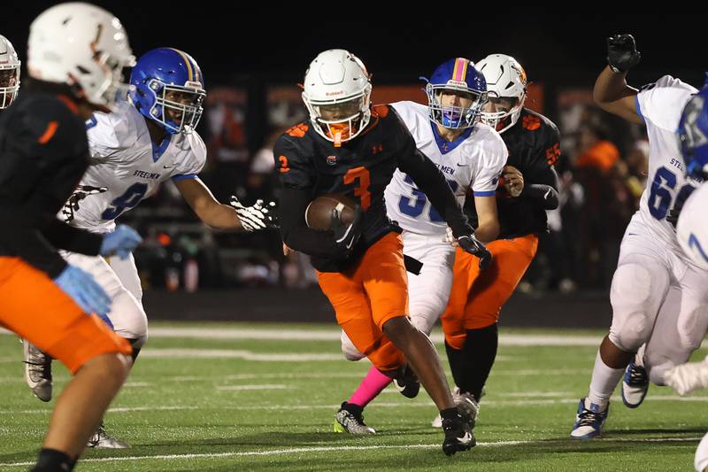 Plainfield East’s Jeremiah Jenkins rushes against Joliet Central on Oct. 4, 20234 in Plainfield.