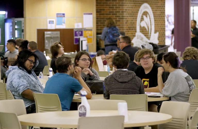 Student talk while eating lunch Monday, Sept. 12, 2022, at McHenry County College, 8900 Route 14 in Crystal Lake.  Monday was the start of 12-week courses, at the campus. The  regular semester started several weeks ago.
