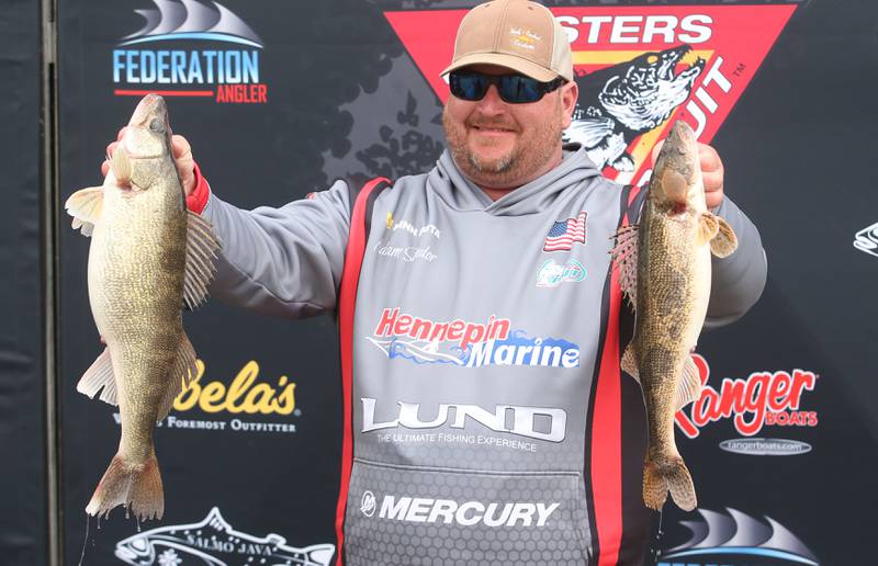 Adam Sandor of Oglesby, holds his large walleye fish that he caught during the annual Masters Walleye Circuit tournament on Friday, March 21, 2025 at the Spring Valley Boat Club. Sandor was the leader after the first day of the two-day tournament.