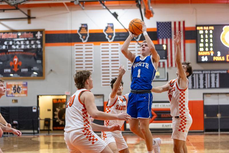 Wheaton North's Henry Schlickman hangs a jumper against St. Charles East on Saturday, Dec.13,2025 in St. Charles.