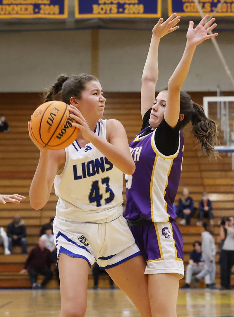 Lyons' Emma O'Brien (43) looks to pass the ball during the girls varsity basketball game between Downers Grove North and Lyons Township on Saturday, Jan. 11, 2025 in La Grange.