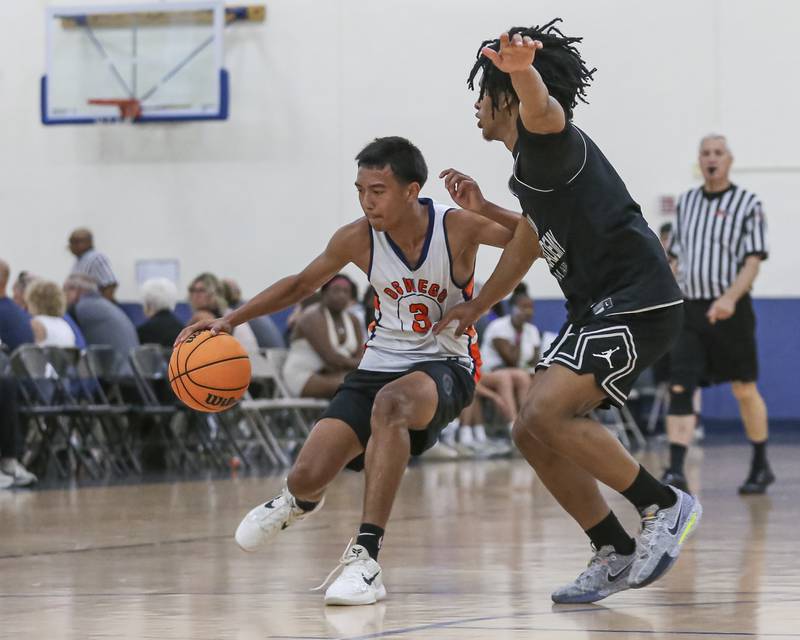 Oswego's Ethan Vahl (3) handles the ball against the defense in their Riverside-Brookfield Shootout basketball game.  June 20, 2025 in Riverside.