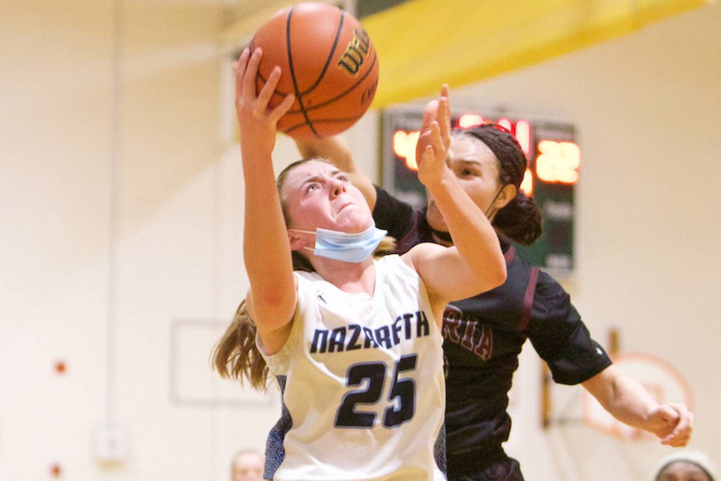 Nazareth Academy's Amalia Dray shoots over Peoria Central's Denali Craig Edwards