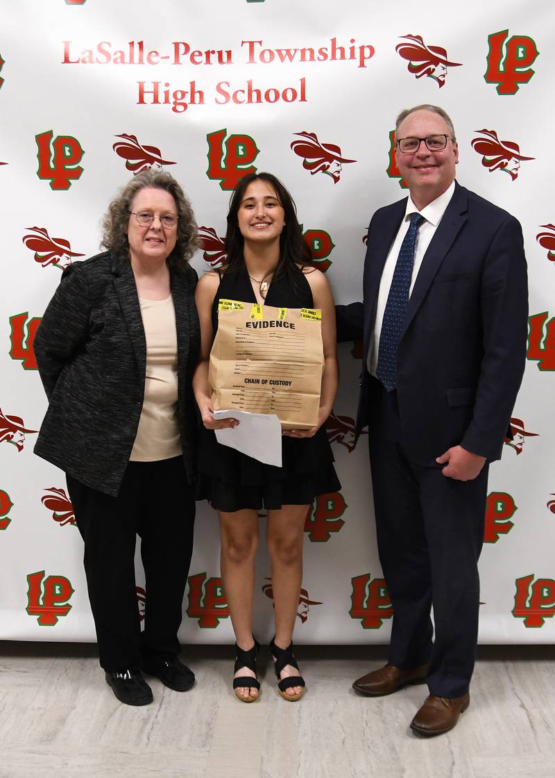 Emily Bonnell (middle) received the Nancy Kochis/Brian Towne Scholarship for the Legal Profession. The $500 scholarship was presented by L-P science teacher Nancy Kochis (left) and attorney Brian Towne (right).