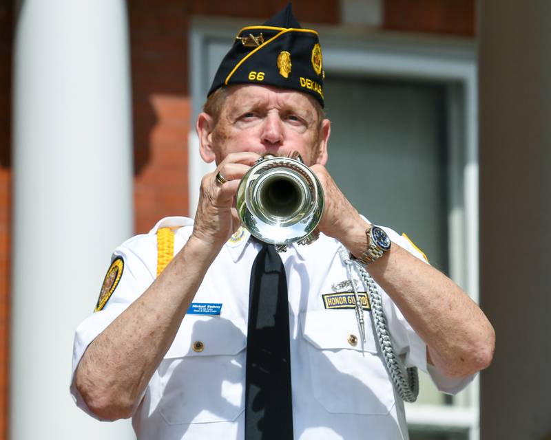 Michael Embrey plays Taps during the Memorial Day ceremony on Monday May 30th held on the Ellwood House lawn in DeKalb.