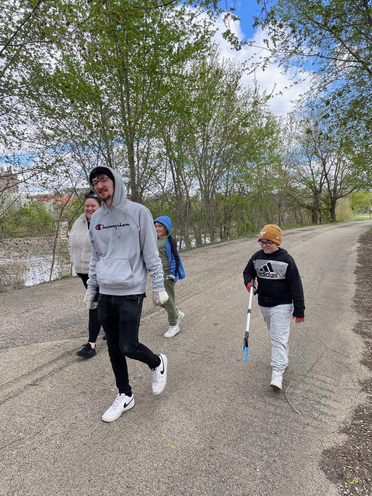 Ethan Baer of La Salle (second from left) leads a volunteer clean-up crew including (from left) McKenzie, Reece and Ryker Walker on Saturday, April 20, 2024, at Lock 16 in La Salle, where the Perfectly Flawed Foundation held an Earth Day cleanup.