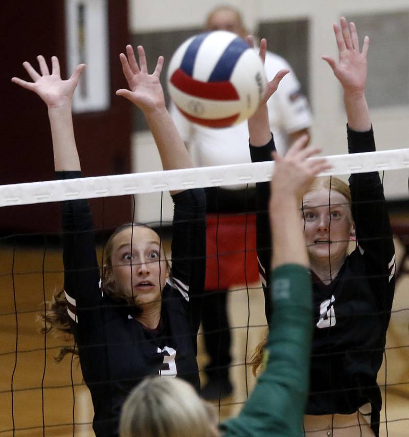 Prairie Ridge's Abby Smith and Sonora Bekere tries to block the ball during the IHSA Class 3A Prairie Ridge Regional championship volleyball match against Crystal Lake South on Thursday, Oct. 30, 2025, at the Prairie Ridge High School in Crystal Lake.