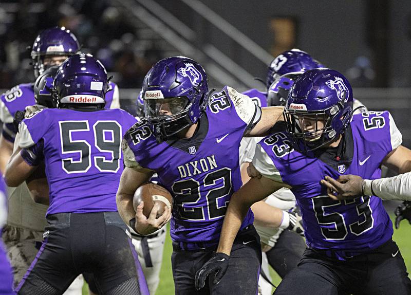 Dixon’s Aiden Wiseman fights for yards in a first round playoff game against Plano Friday, Oct. 27, 2023 in Dixon.