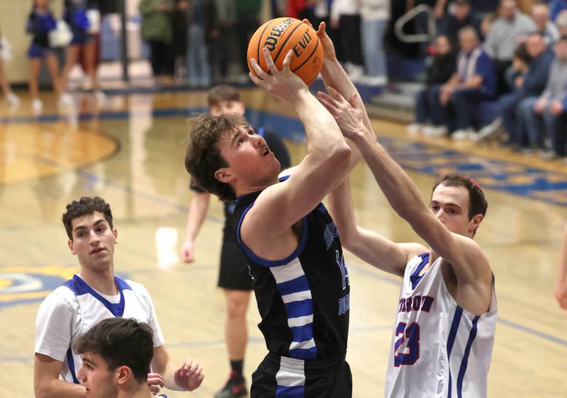 Hinckley-Big Rock's Martin Ledbetter shoots over over Ida Crown’s Avi Okner during their Class 1A sectional game Wednesday, March 5, 2025, at Somonauk High School.