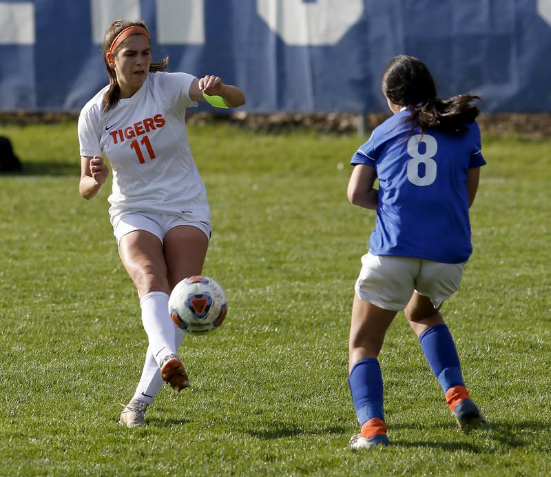 Crystal Lake Central's Kaitlin Gaunaurd takes a shot on goal in front of Dundee-Crown's Margarita Hernandez during a Fox Valley Conference soccer match Tuesday April 26, 2022, between Crystal Lake Central and Dundee-Crown at Dundee-Crown High School.