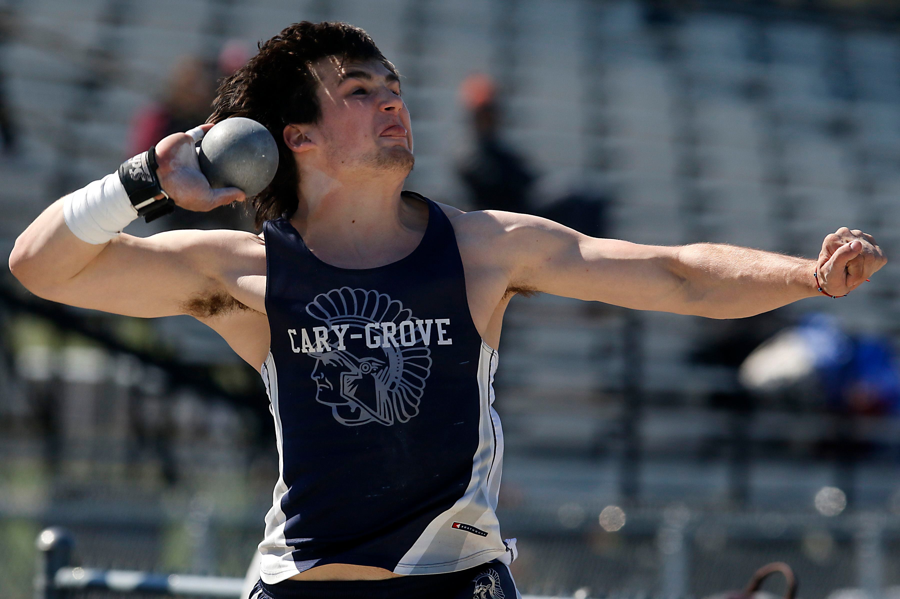 Cary-Grove’s Logan Abrams throws the shot putt on Friday, April 19, 2024, during the McHenry County Track and Field Meet at Cary-Grove High School.