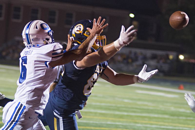 Sterling's Jason Farnham reaches but just can't come up with a catch in the endzone Friday, Oct. 01, 2021 against Quincy.