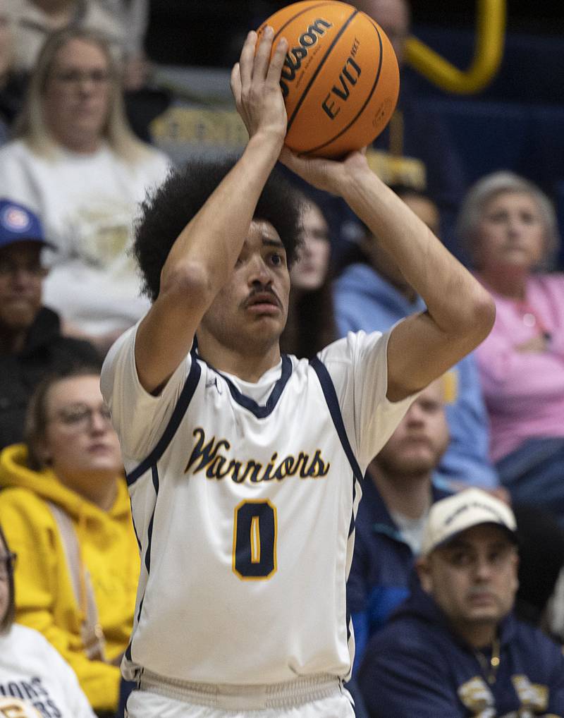 Sterling’s Xavian Prather puts up a three point shot against Quincy Friday, Jan. 30, 2026.