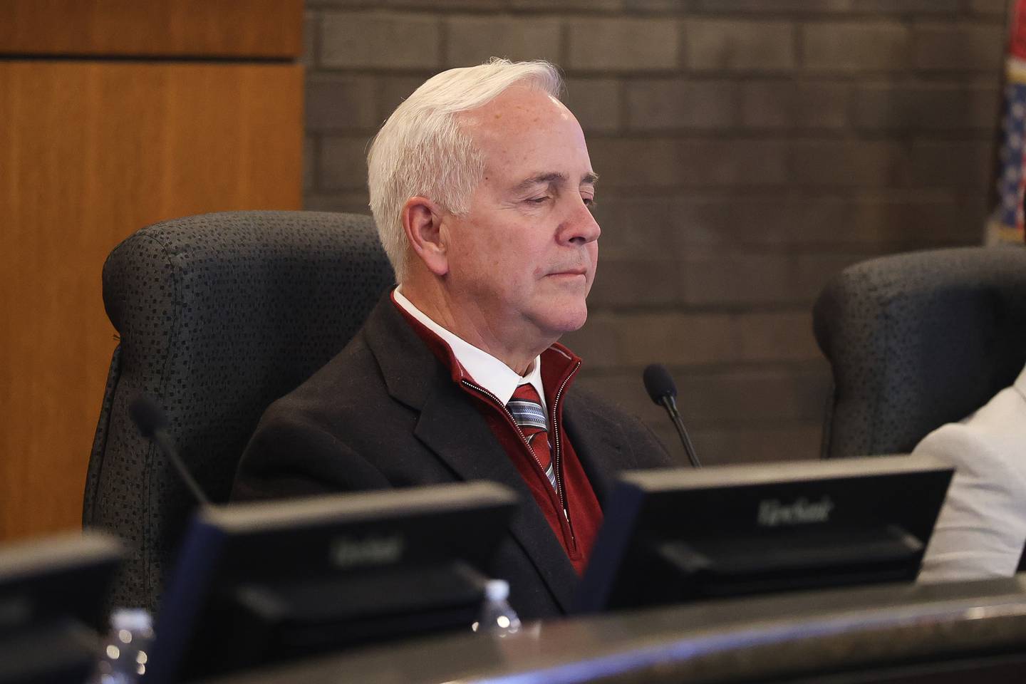 Mayor Terry D’Arcy looks at a slide show presentation during the Joliet city council meeting to vote on the Joliet Catholic Academy stadium plan on Tuesday, Jan 20, 2026 in Joliet.