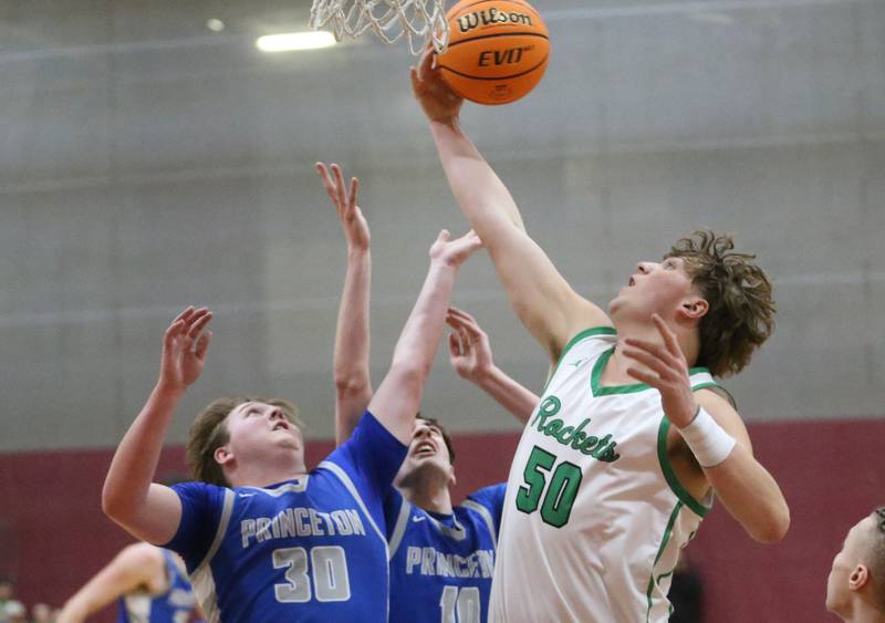 Rock Falls's Cole Mulnix grabs a rebound over Princeton's Jordan Reinhardt during the Class 2A Sectional final on Friday, March 7, 2025 at Marengo High School.