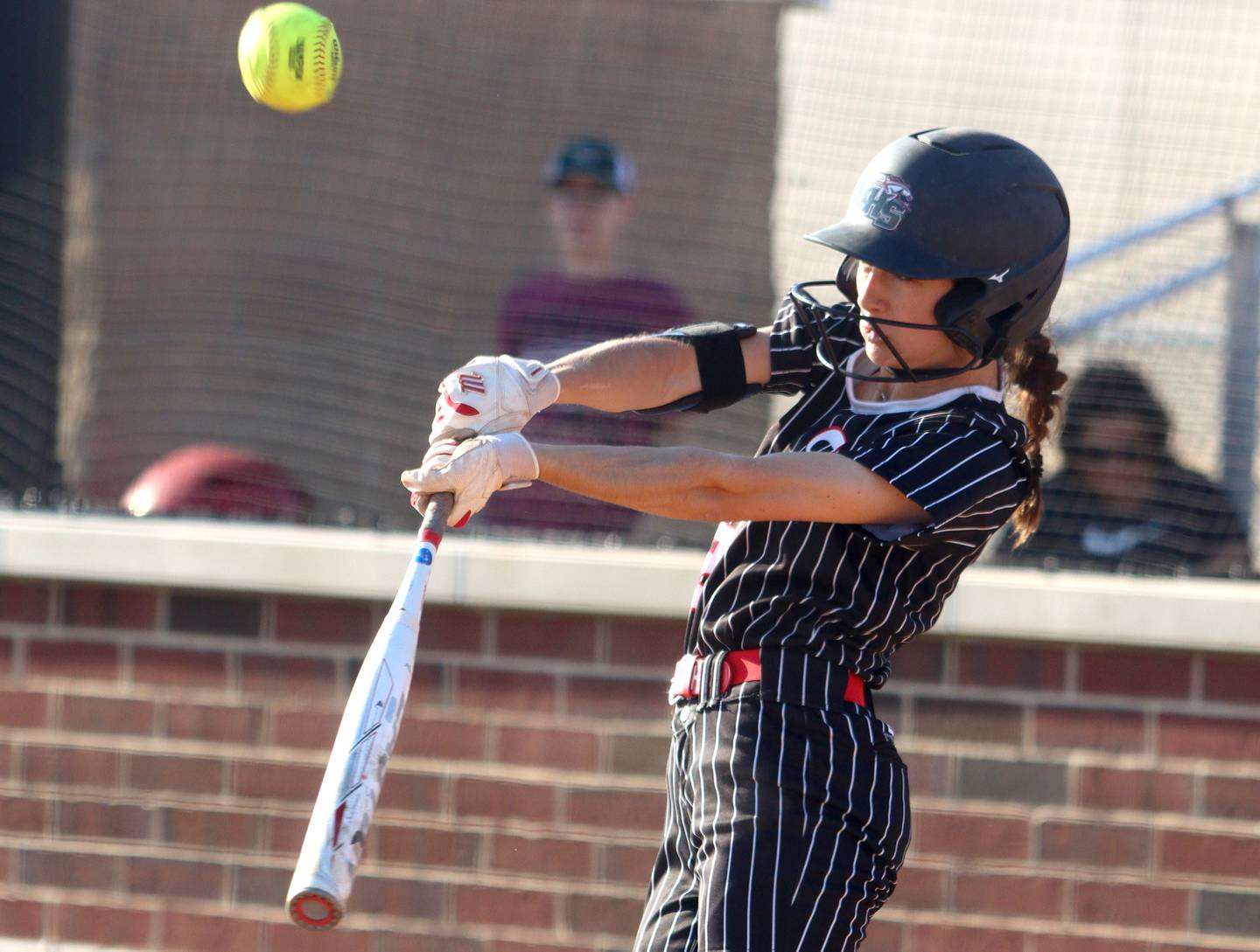 Huntley’s Katie Mitchell bats against McHenry in varsity softball at Huntley Friday.