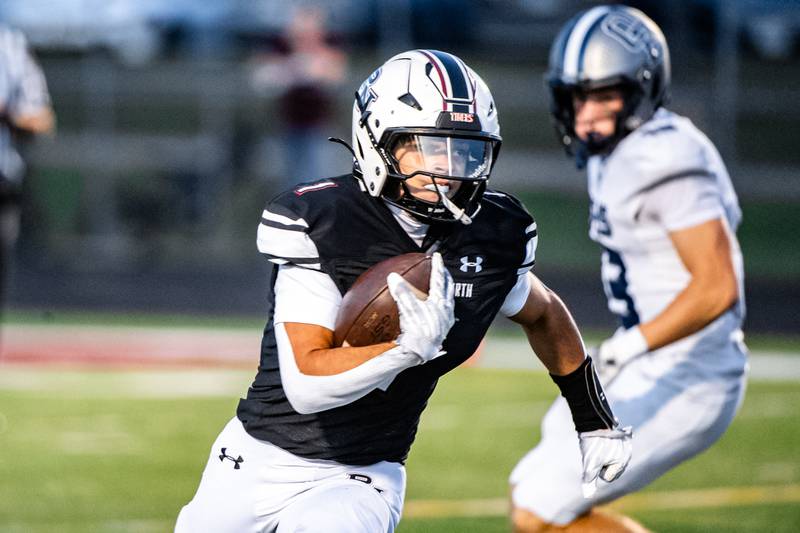 Plainfield North's Nick Wilson runs the ball  during a game against Oswego East on Friday Sept. 12, 2025 at Plainfield North High School in Plainfield