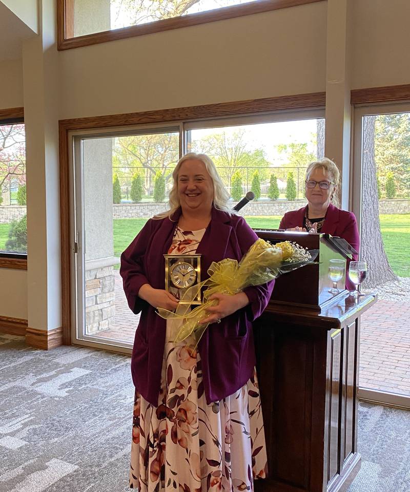 Barbi Brewer-Watson accepts the Woman of Achievement Award. Amy LaFine, Zonta Club of Kankakee president, is at the podium.