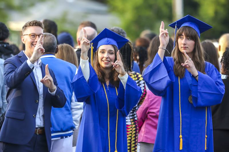 Students sign the National Anthem at the start of the Lyons Township High School Graduation ceremony Wednesday, May 28, 2025  in Western Springs.