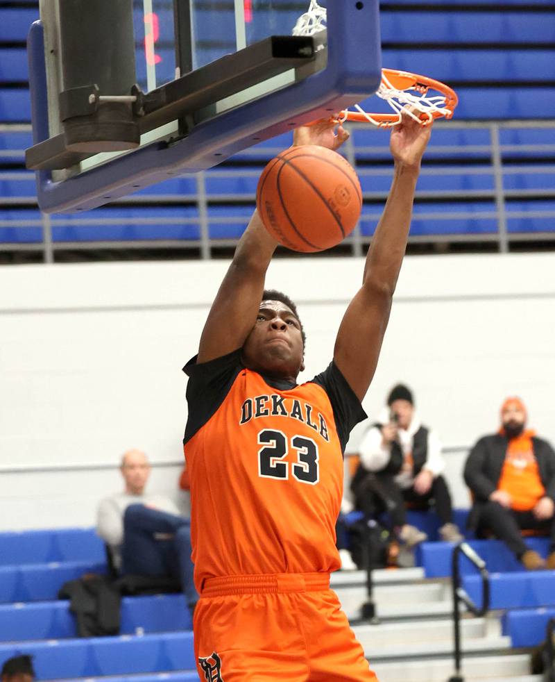 DeKalb’s Davon Grant throws down a dunk Monday, Jan. 15, 2023, during their game against Lyons Township in the Burlington Central Martin Luther King Jr. boys basketball tournament.