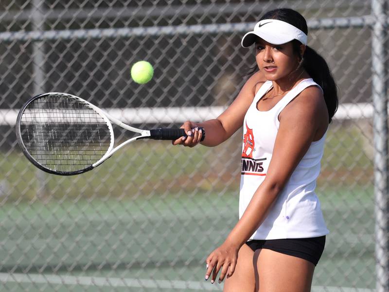 DeKalb’s Preeti Islam hits a shot during her doubles match against Sycamore Wednesday, Sept. 18, 2024, at Sycamore High School.