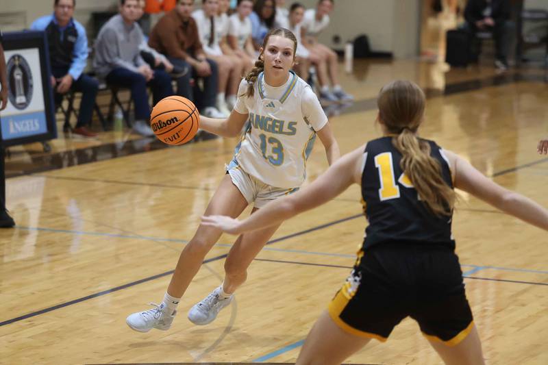 Joliet Catholic’s Abigail Dulinsky looks to make a play against Marian Catholic on Monday, Dec. 9, 2024 in Joliet.