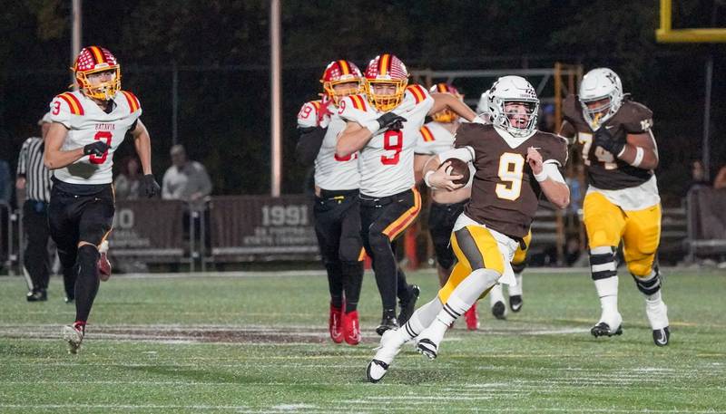 Mt. Carmel's Jack Elliott (9) carries the ball on a keeper for a touchdown against Batavia during a class 7A semifinal football playoff game at Mt. Carmel High School in Chicago on Saturday, Nov 18, 2023.