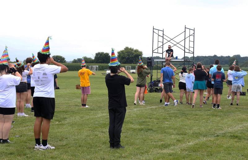 New Band Director of the Kaneland Marching Knights, Kyle Baltzer, talks to students at band camp on Friday, August 2, 2024 in Maple Park.