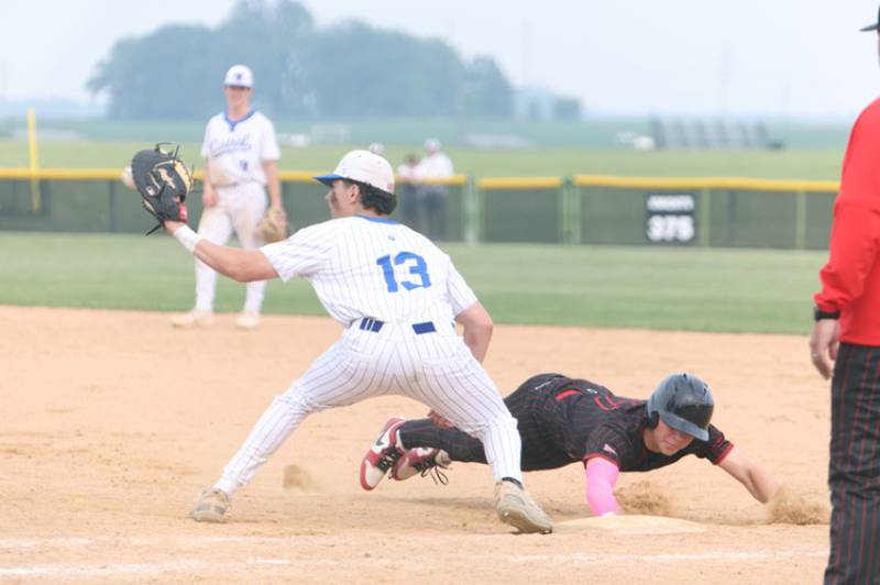Benet's Nathan Cerocke slides bak into first before the tag by Burlington Central's Connor Finn  at the Class 3A Kaneland Sectional Semi Final on Thursday, June 5, 2025 in Maple Park.