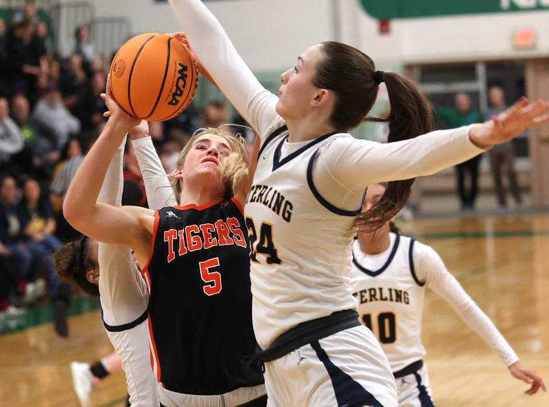 Crystal Lake Central's Ruby Macke tries to get a shot up against Sterling's Madison Austin during their Class 3A sectional semifinal game Tuesday, Feb. 25, 2025, at Boylan Catholic High School in Rockford.
