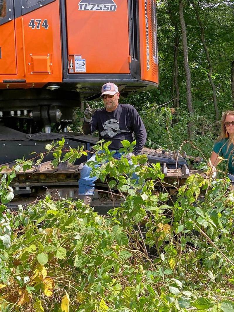 Brian Maher protested the cutting of trees Tuesday on a Geneva Township property where an industrial park is being proposed. One part of the land contains a grove of trees, including native bur oaks that are up to 300 years old.