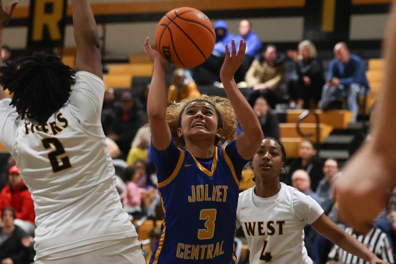 Joliet Central’s Nevaeh Wright battles under the basket for a shot against Joliet West on Thursday, Jan 30, 2025 in Joliet.