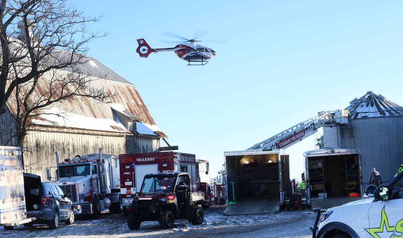 An OSF lifeflight helicopter airlifts one victim involved in a grain bin collapse on Monday, Jan. 26, 2026 in the 13000 block of North 950th Avenue just south of Granville. Two lifeflight helicopters laned and one victim was flown from the scene.