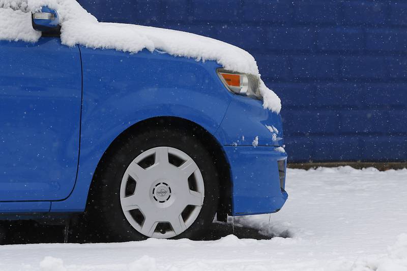 Snow covers the hood of a car on Wednesday, Jan. 25, 2023, in McHenry. Snow fell throughout the morning, leaving a fresh blanket of snow in McHenry County.