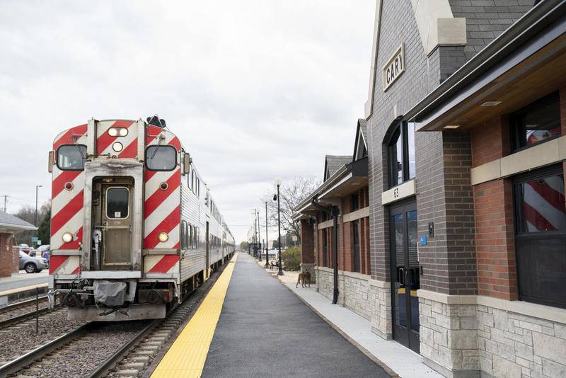 A Chicago-bound Metra train pulls into the new Cary Metra Station after a dedication ceremony for the station on Wednesday, Nov. 6, 2019.