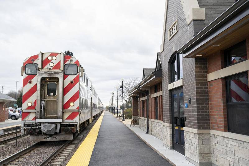 A Chicago-bound Metra train pulls into the new Cary Metra Station after a dedication ceremony for the station on Wednesday, Nov. 6, 2019.
