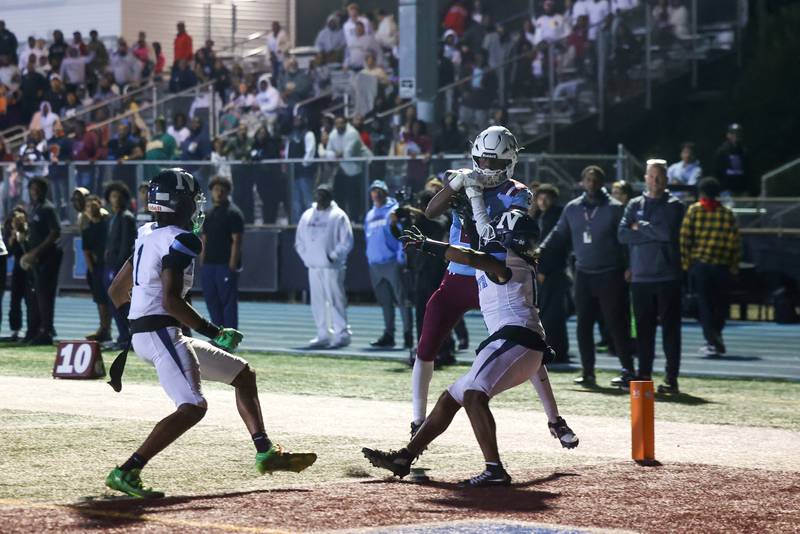 Kankakee's Ezekiel Sherrod makes a touchdown catch contested by Nazareth's Eddie McClain, right, during Kankakee's 33-12 loss to Nazareth on Friday, Aug. 29, 2025.