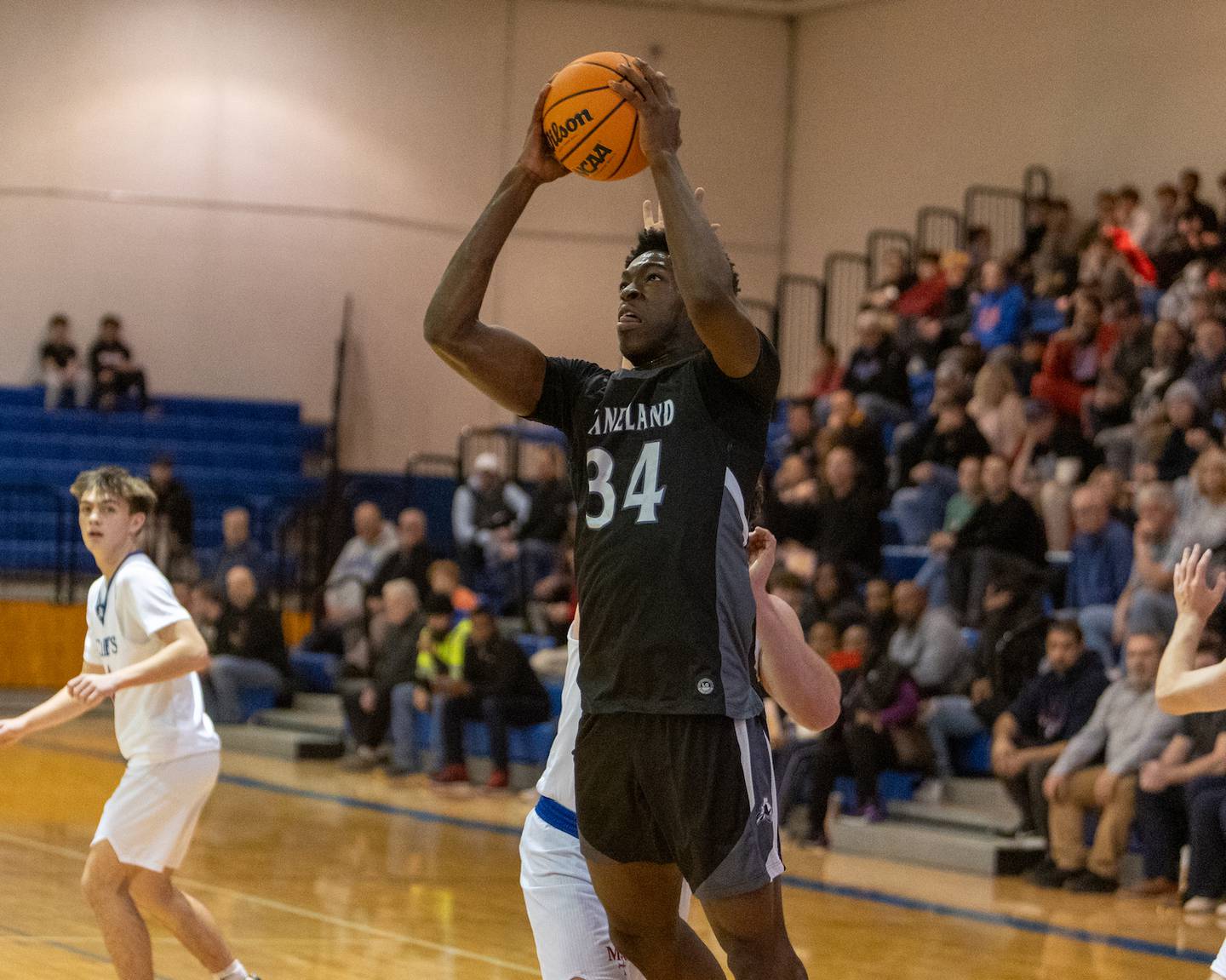 Kaneland's Jeffery Hassan shots a jumper against Marmion on Wednesday, Dec.17,2025 in Aurora.