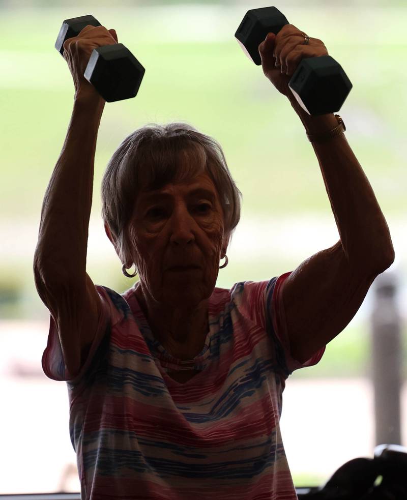 Jan Edwards lifts some weights Friday, April 28, 2023, during Rock Steady Boxing for Parkinson's Disease class at Northwestern Medicine Kishwaukee Health & Wellness Center in DeKalb. The class helps people with Parkinson’s Disease maintain their strength, agility and balance.