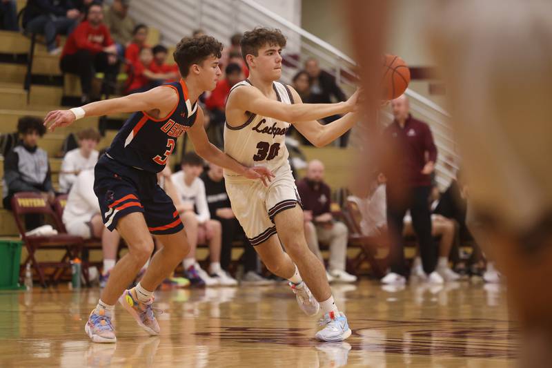 Lockport’s Evan Dziadkowiec passes against Oswego.