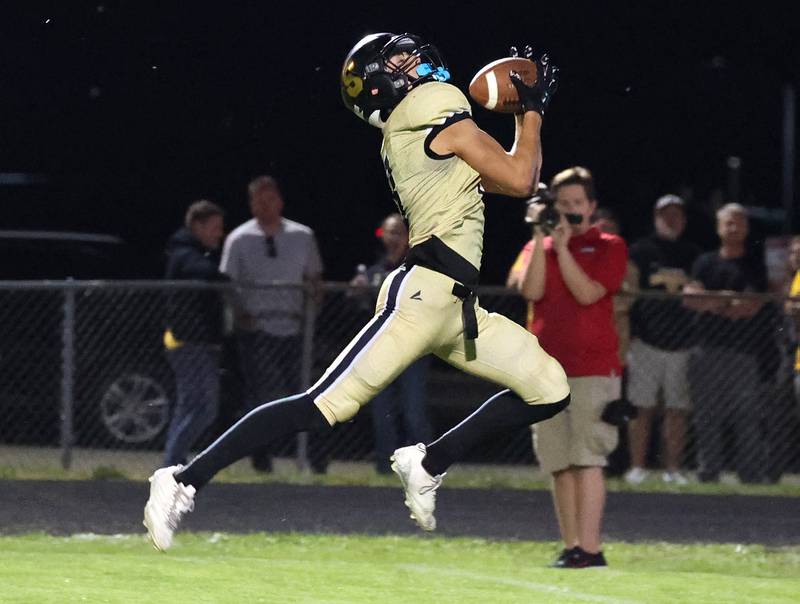 Sycamore's Benjamin Anderson catches a long touchdow pass during their game against Rochelle Friday, Sept. 19, 2025, at Sycamore High School.