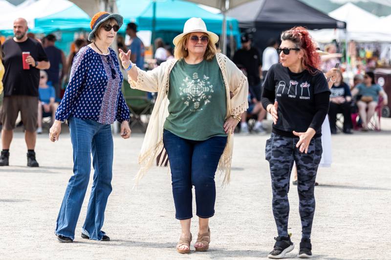 Glory Gayle, Jan Hood, and Pam Plotkin dance to the sounds of Funk'd Up during Old Canal Days in Lockport on June, 7, 2025.