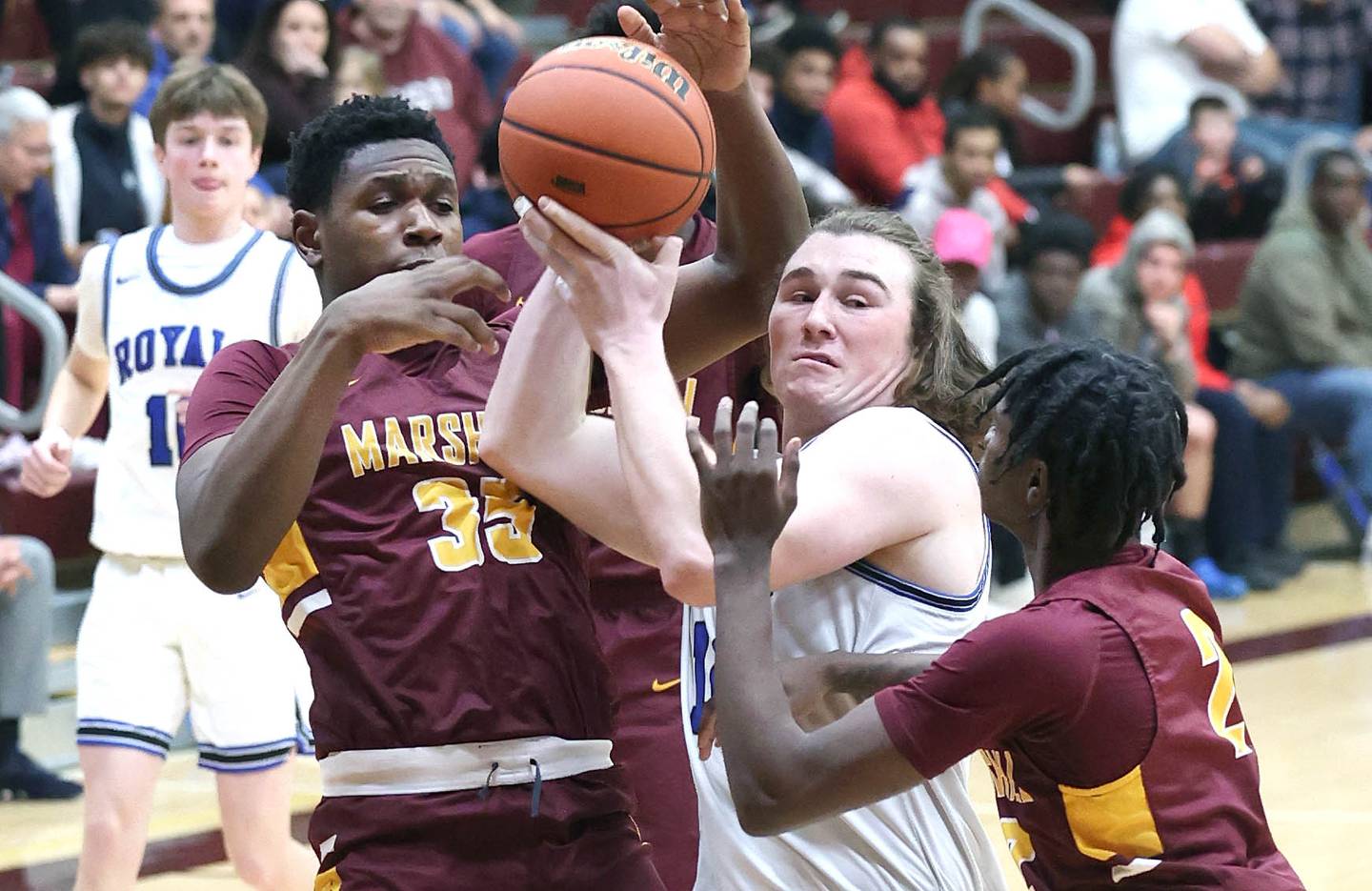 Hinckley-Big Rock's Martin Ledbetter drives between two Chicago Marshall defenders Wednesday, March 1, 2023, during their Class 1A sectional semifinal matchup at Elgin High School.