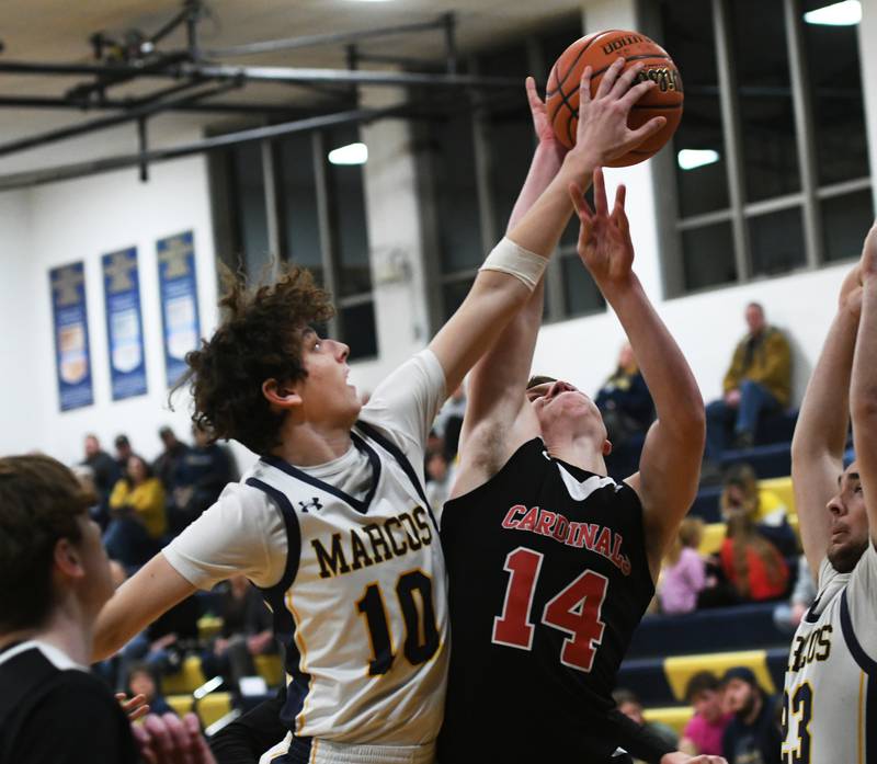 Forreston's Owen Greenfield (14) shoots as Polo's Carter Merdian (10) gets a piece of the ball during a NUIC game in Polo on Thursday, Jan. 19.